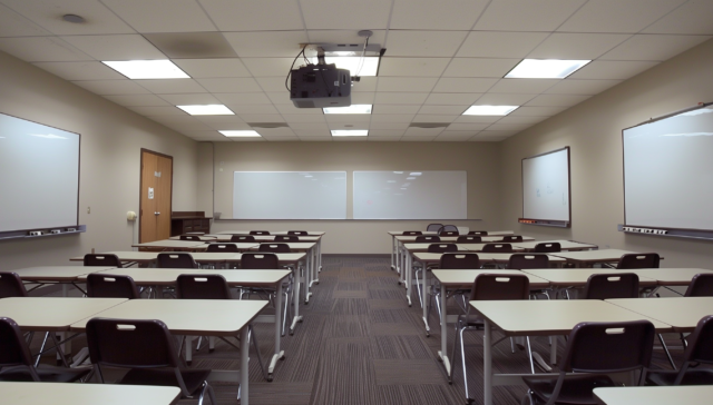 azink86_An_empty_classroom_with_desksand_chairs_arranged_in_row_b5132e83-9216-4b9e-9b6f-74aaf876d001